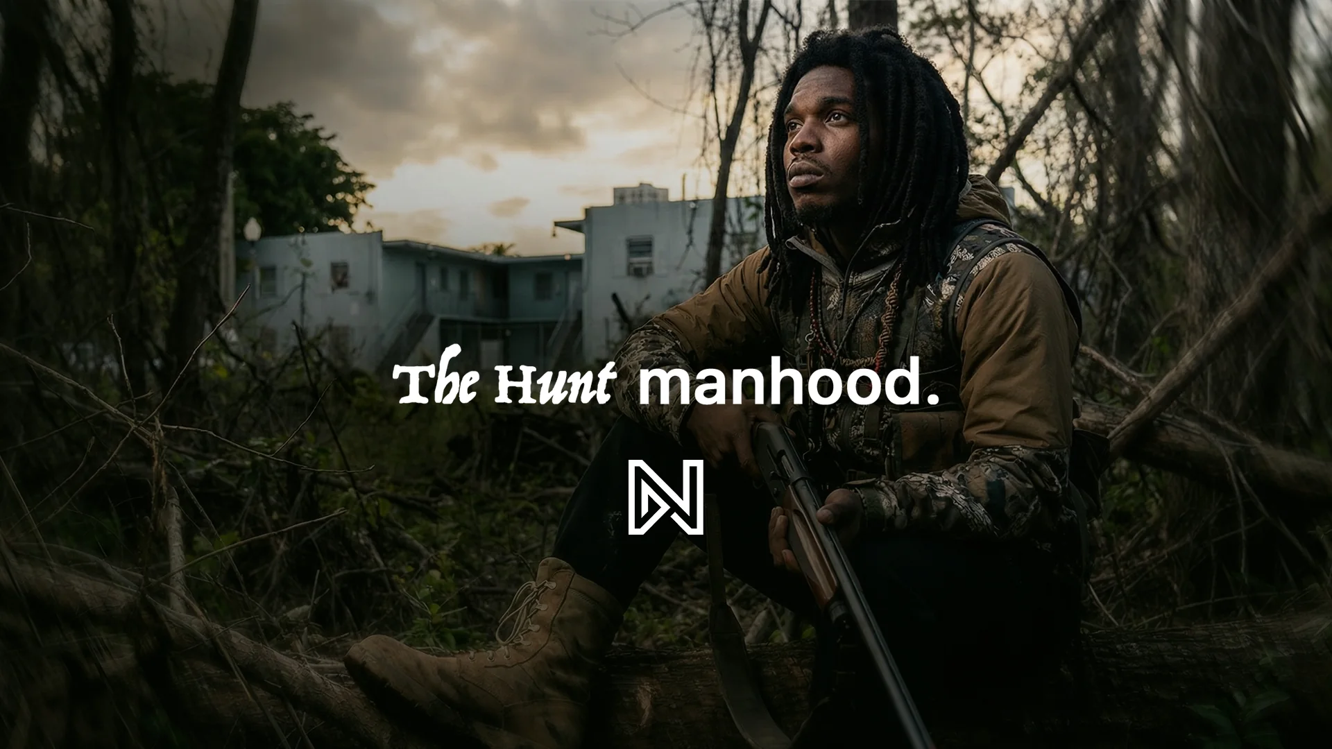 A young man in camouflage kneels in the woods with a rifle, under the words The Hunt, manhood